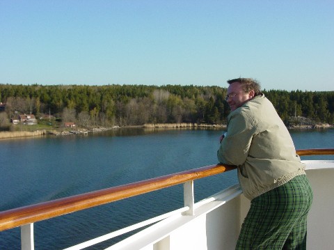Allen on the balcony in his pajamas